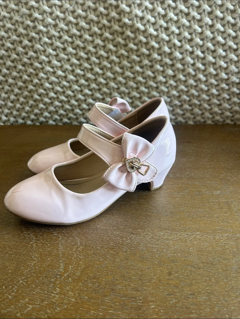 Pale pink shiny Maryjane heels with bow clasp. Perfect for fancy or dress up!